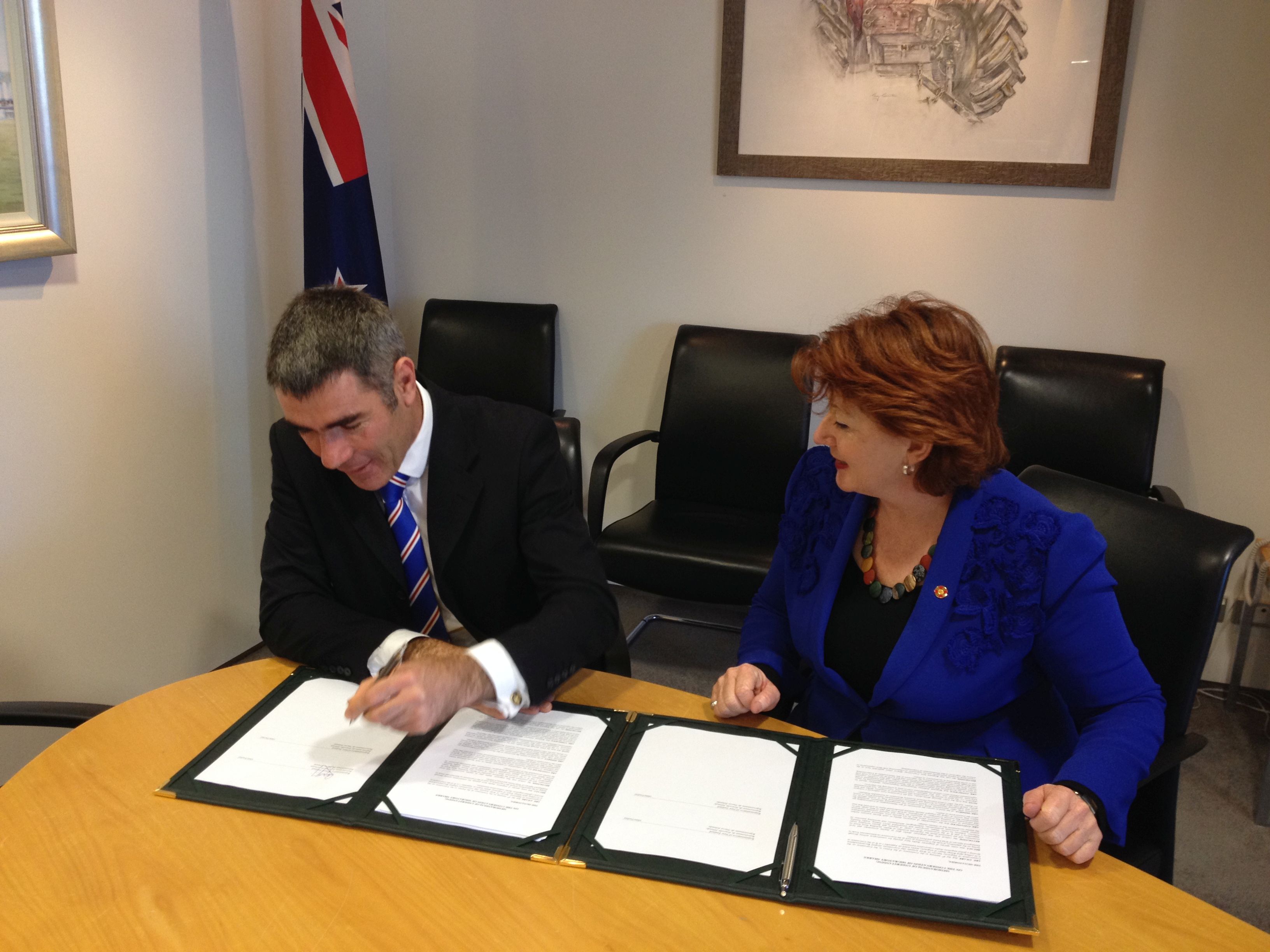 New Zealand signs the MOU - Nathan Guy (Minister for Primary Industries) and Maggie Barry (Minister of Conservation)