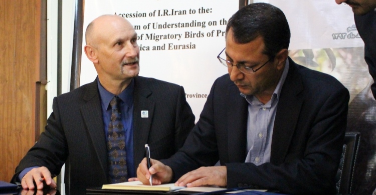 Dr. Ahmad Ali Keykha, Deputy Head of the Department of Environment and Natural Environment, I.R. Iran, signing the Raptors MoU. Photo by Omidi Maryam.